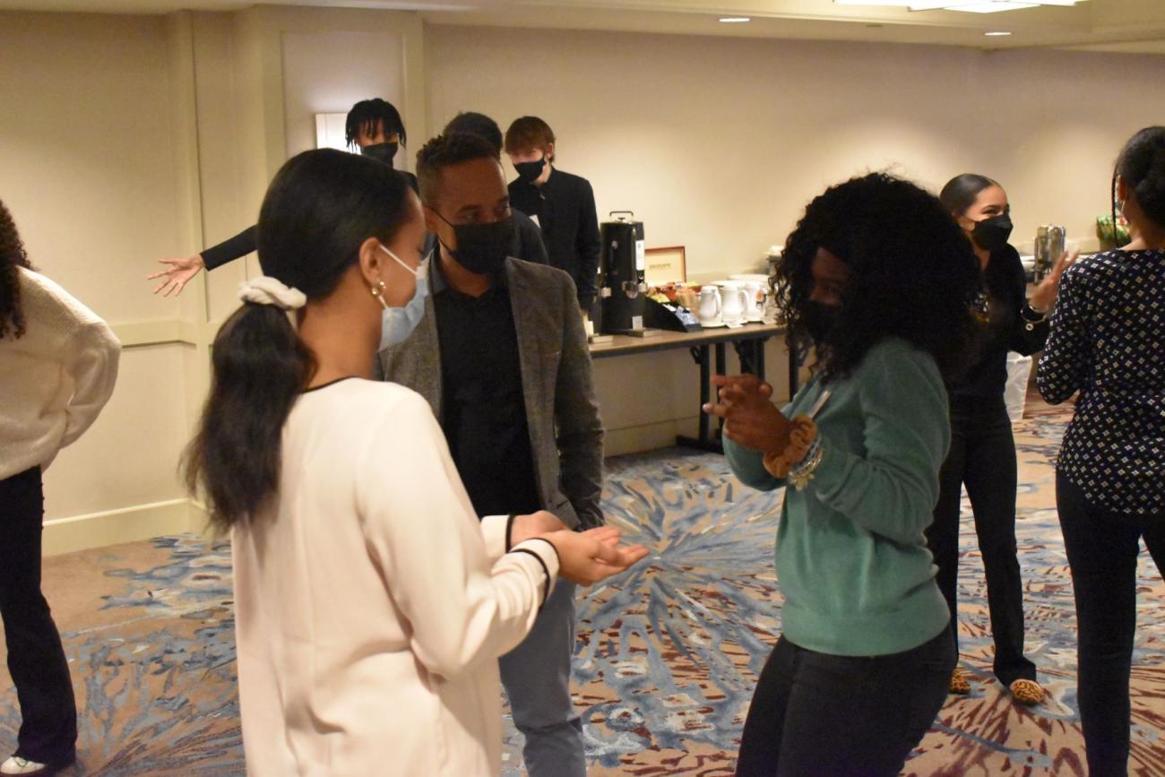 Young people talking to each other in group setting